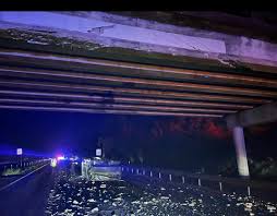 Image of: # Raised Dump Bed Hits I-10 Overpass: A Cautionary Tale for Truck Drivers